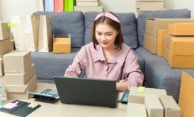 woman with online business product boxes