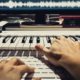 music producer using organ to create soundtrack