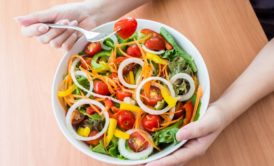 woman eating vegan meal