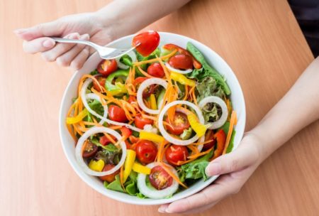 woman eating vegan meal