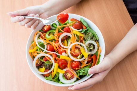 woman eating vegan meal