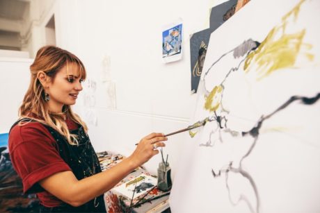 artist painting character on wall