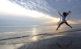 woman leaping in happiness