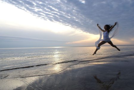 woman leaping in happiness