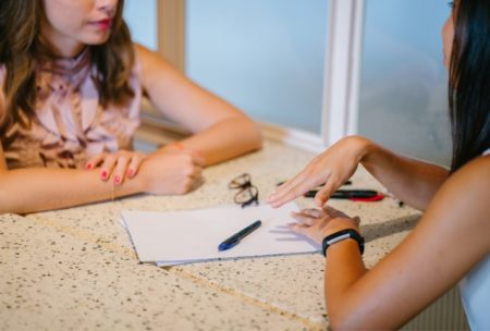 therapist talking to female patient