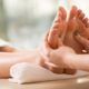 individual receiving a soothing foot massage in a tranquil spa, emphasizing the relaxation offered by reflexology courses online