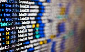 Code-filled computer screen for superhero name generator