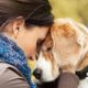 woman hugging dog