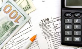 A document with forms and calculations related to C corporation income tax