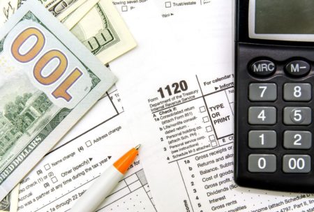 A document with forms and calculations related to C corporation income tax