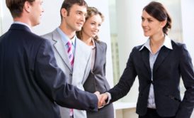 sales executive shaking hands