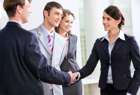 sales executive shaking hands