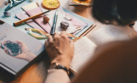 woman writing in journal