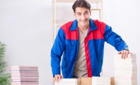 author with stacks of books