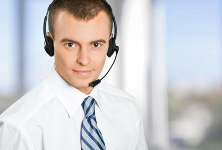 A professional man wearing a headset and tie, representing the concept of hiring virtual assistants