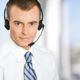 A professional man wearing a headset and tie, representing the concept of hiring virtual assistants