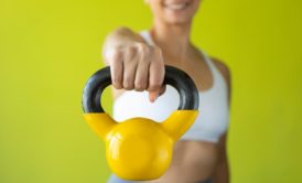 woman holding kettlebell