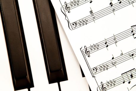 piano keyboard and musical sheets