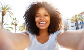 happy woman in white shirt