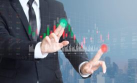 businessman interacting with a virtual stock market display, symbolizing beginners guide to stock market investing