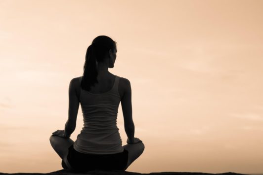 woman meditating in sitting position