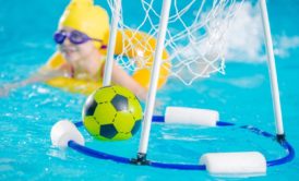 child in swimming lesson