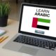 Arabic For Beginners. A digital image showing a laptop with a language learning website open, displaying Arabic text and lessons.
