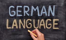 German for Beginners concept with German Language chalked on a blackboard, indicating a start to learning German