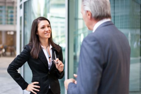 woman negotiating with man in suit