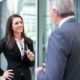 woman negotiating with man in suit