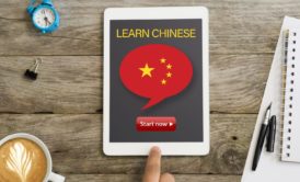 A tablet displaying the interface of a Learn Chinese for Beginners course, featuring introductory Mandarin lessons