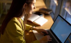 woman typing on laptop