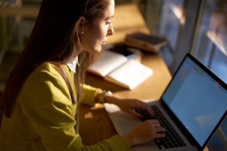 woman typing on laptop