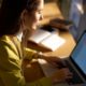 woman typing on laptop