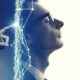 a man in a suit thoughtfully touches his head, reflecting on emotional intelligence and decision making processes