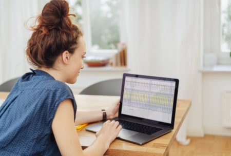 woman using excel on black laptop