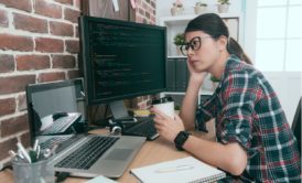 female python programmer holding cup