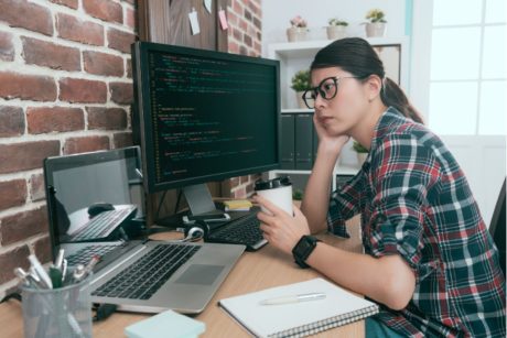 female python programmer holding cup