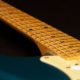 blue guitar with guitar fretboard
