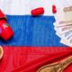 an image depicting the Russian ruble, alongside matryoshka representing a russian language course