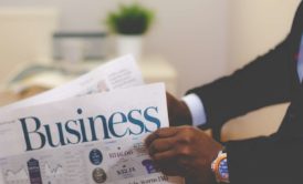 man reading business news