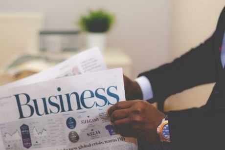 man reading business news