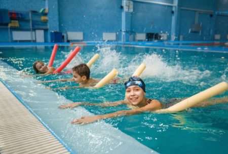 children having swimming lessons
