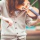 A person learning How to Play the Violin with a bow, creating beautiful music