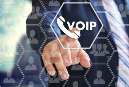 man in suit touching voip button