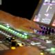 man operating audio mixer