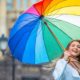 woman holding colorful umbrella