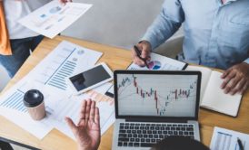 people discussing business performance