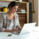 woman working on pinterest white laptop