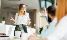 woman presenting to team